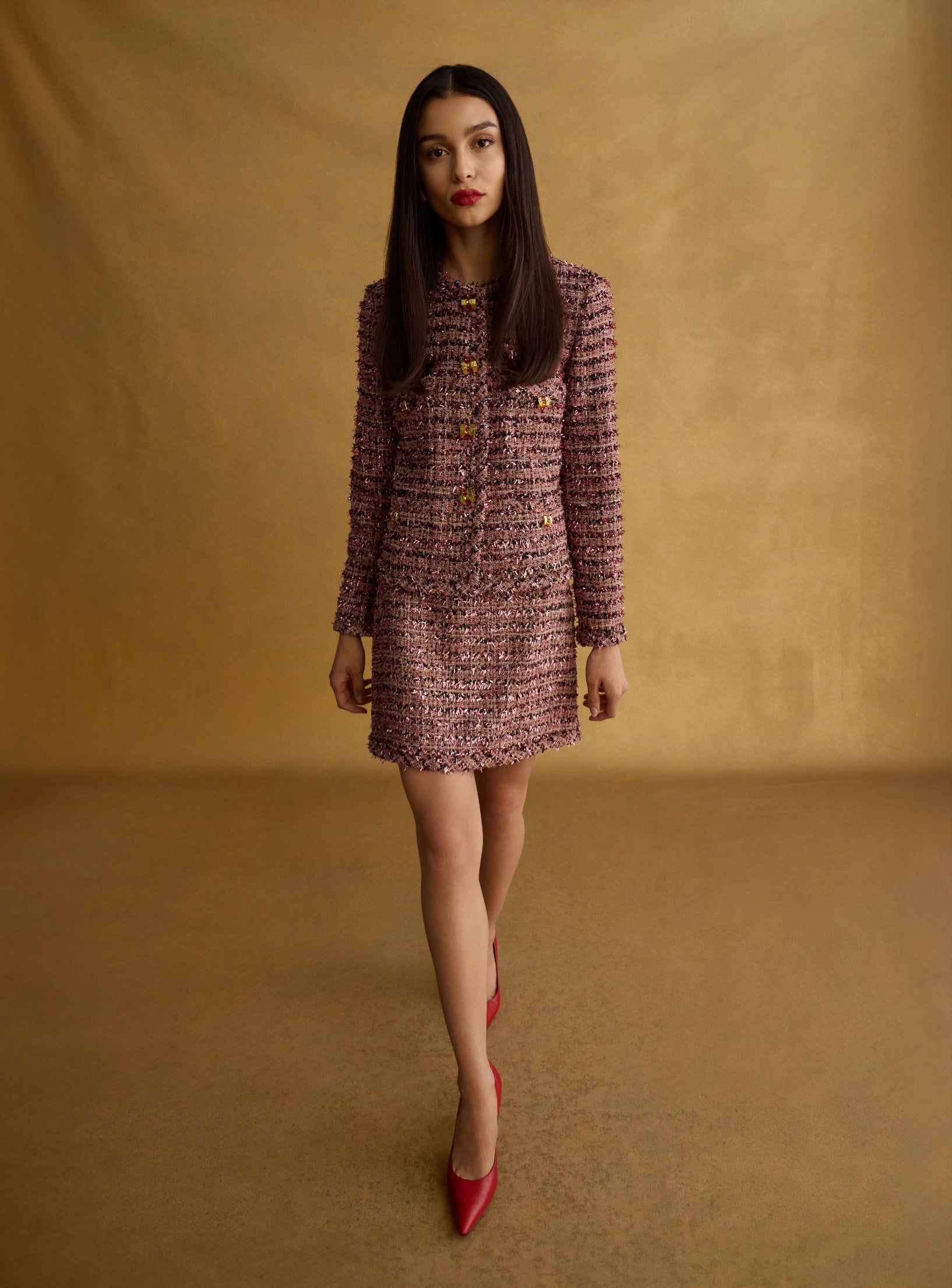 Woman wearing st john knits engagement party dress jacket and matching skirt