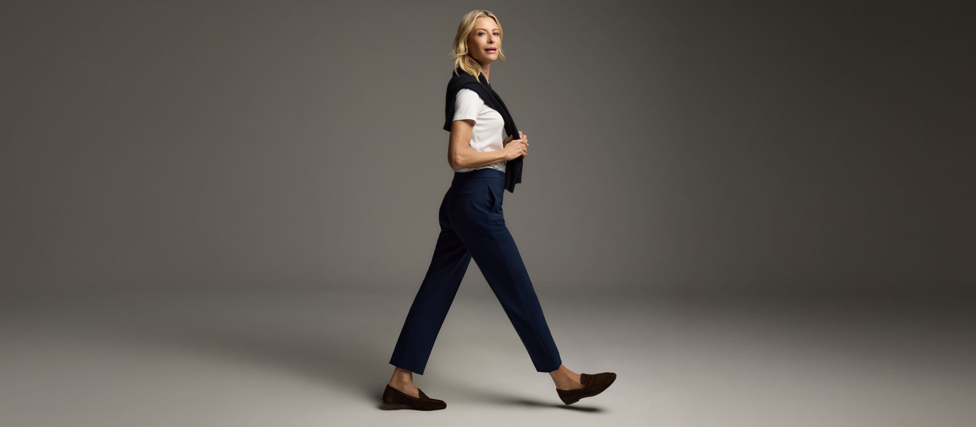 Model wearing the Isabel pant in Midnight walking