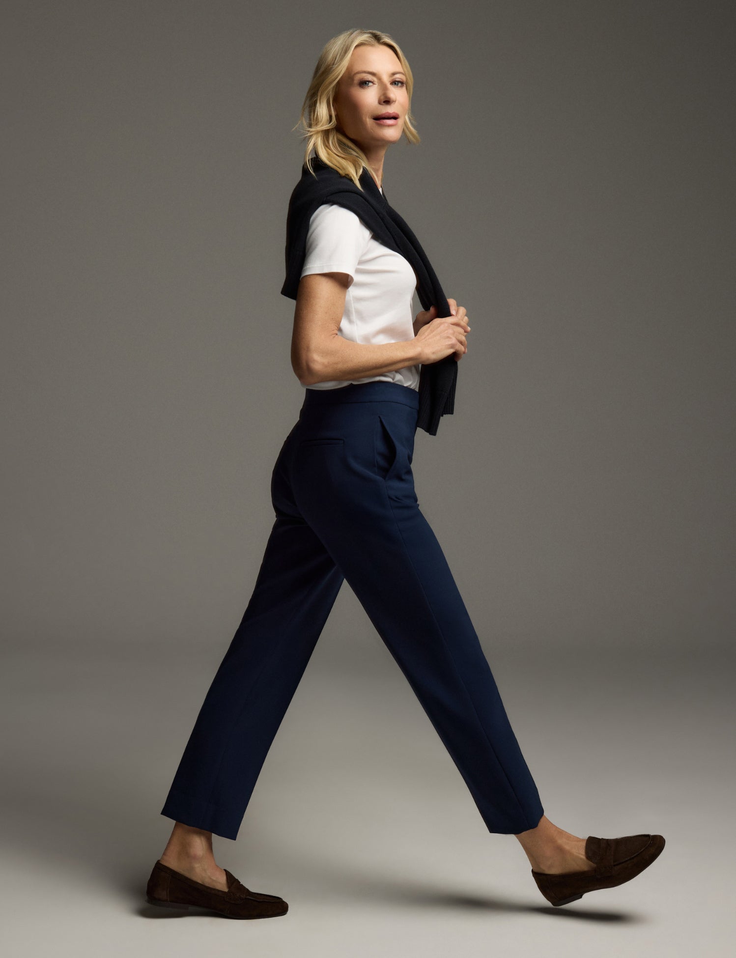 Model wearing the Isabel pant in Midnight walking